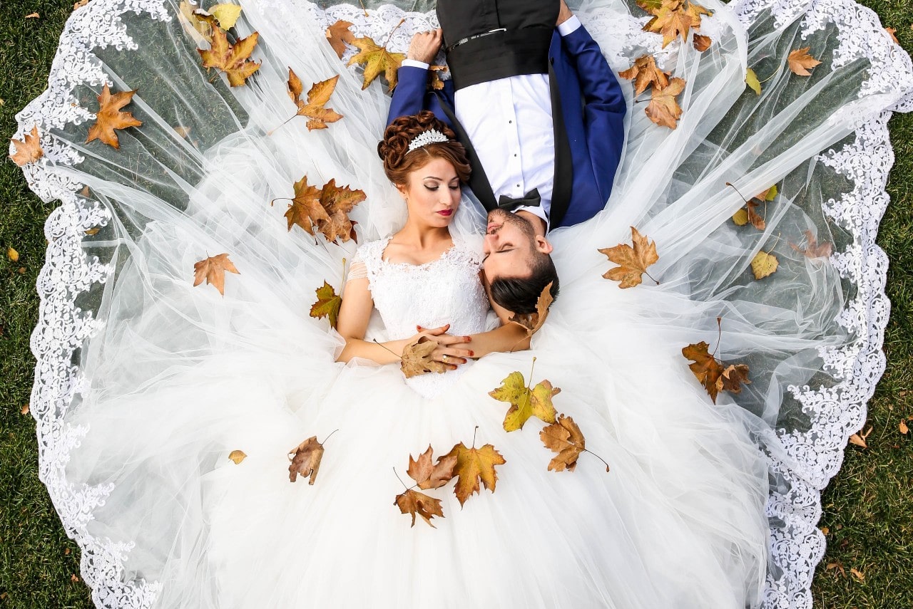 couple laying in grass