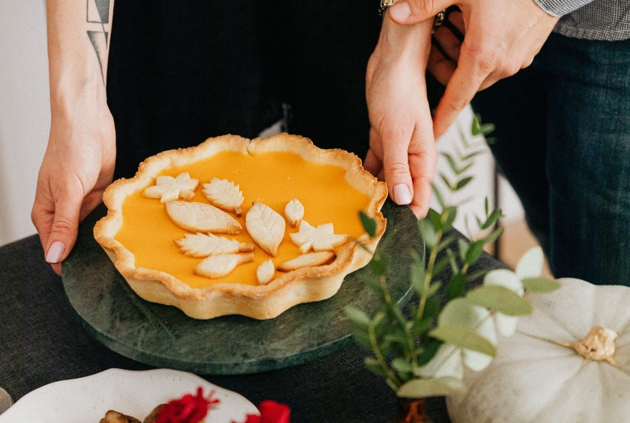 Picture of thanksgiving pie being put on table