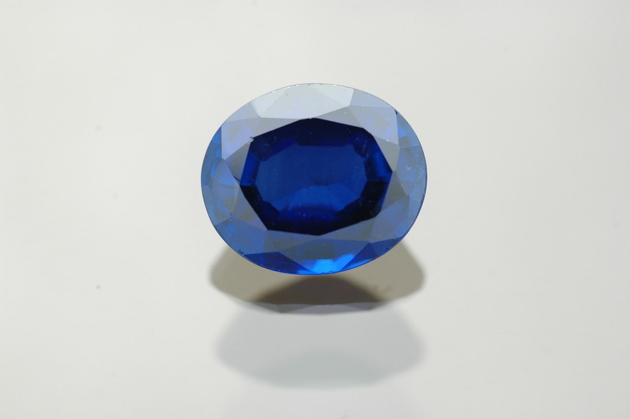 A lone sapphire shinning a vibrant blue