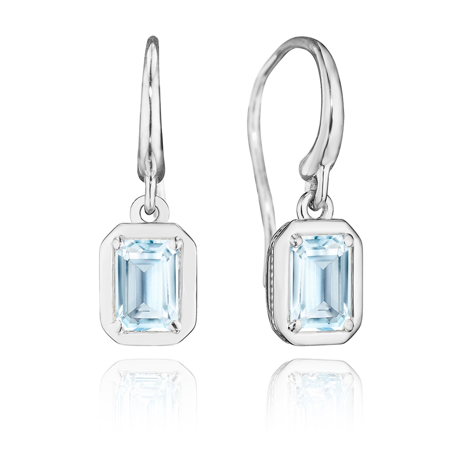 A white gold drop earrings with bezel set blue topaz