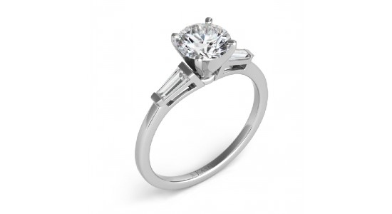 a white gold ring three stone ring featuring a round cut center stone and two baguette side stones