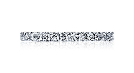 a silver eternity band featuring round-cut diamonds