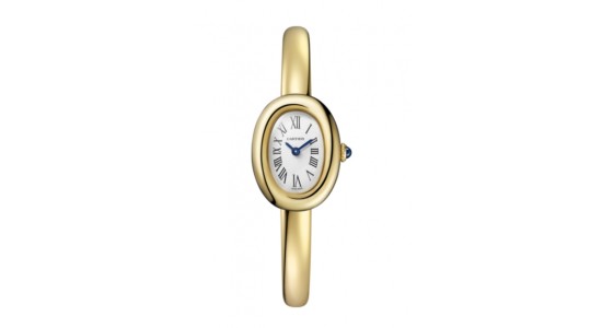 An oval shaped yellow gold watch by Cartier, available at Deutsch & Deutsch.