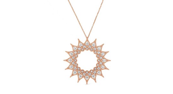 a rose gold starburst pendant necklace with diamond accents