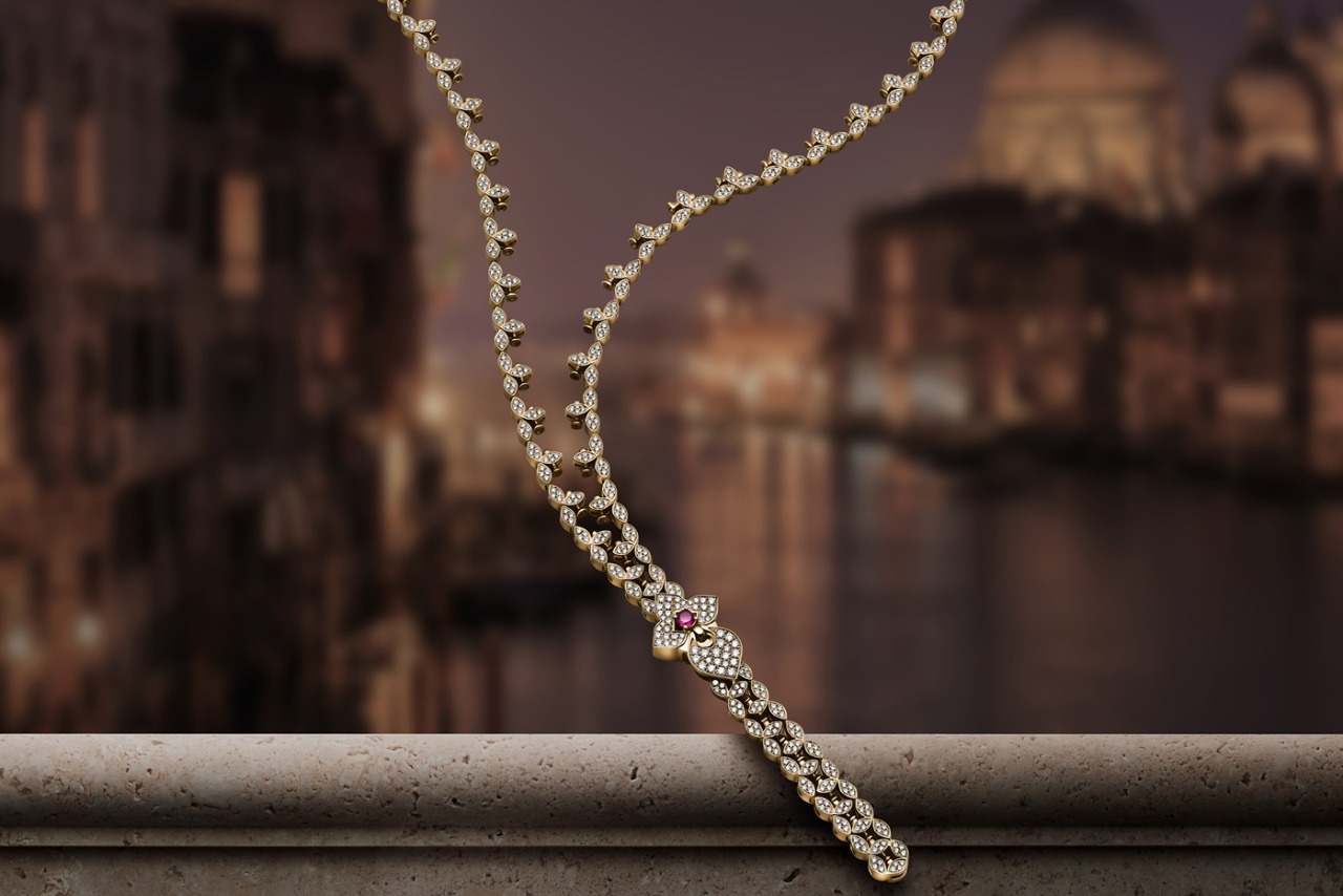 A diamond necklace with ruby detail
