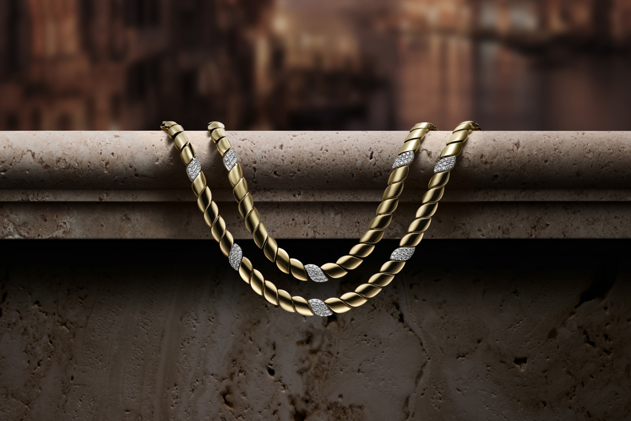 Yellow gold with while gold and diamond details on this classic twisted chain necklace